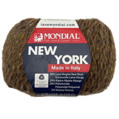 Brown yarn ball with Mondial label on a white background