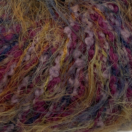 Close-up of multicolored yarn with pink, yellow, and blue threads.