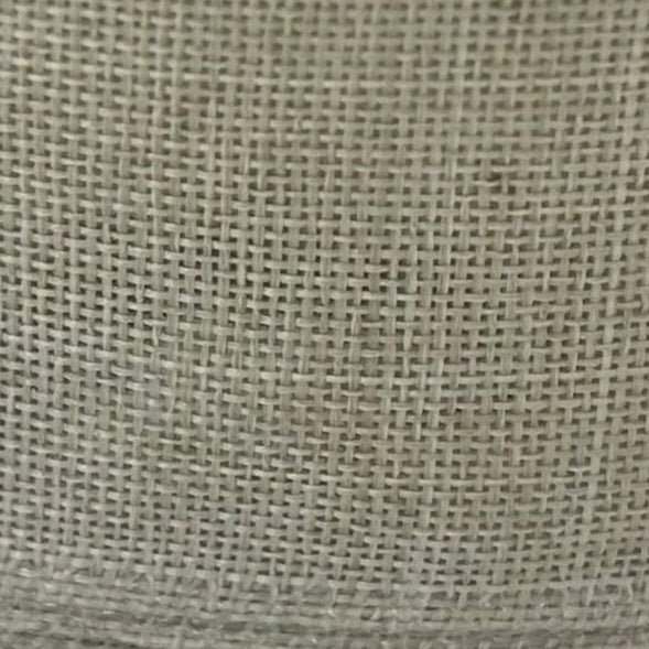 Close-up of a textured beige fabric surface