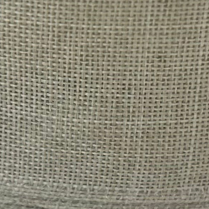 Close-up of a textured beige fabric surface