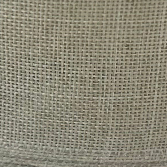 Close-up of a textured beige fabric surface