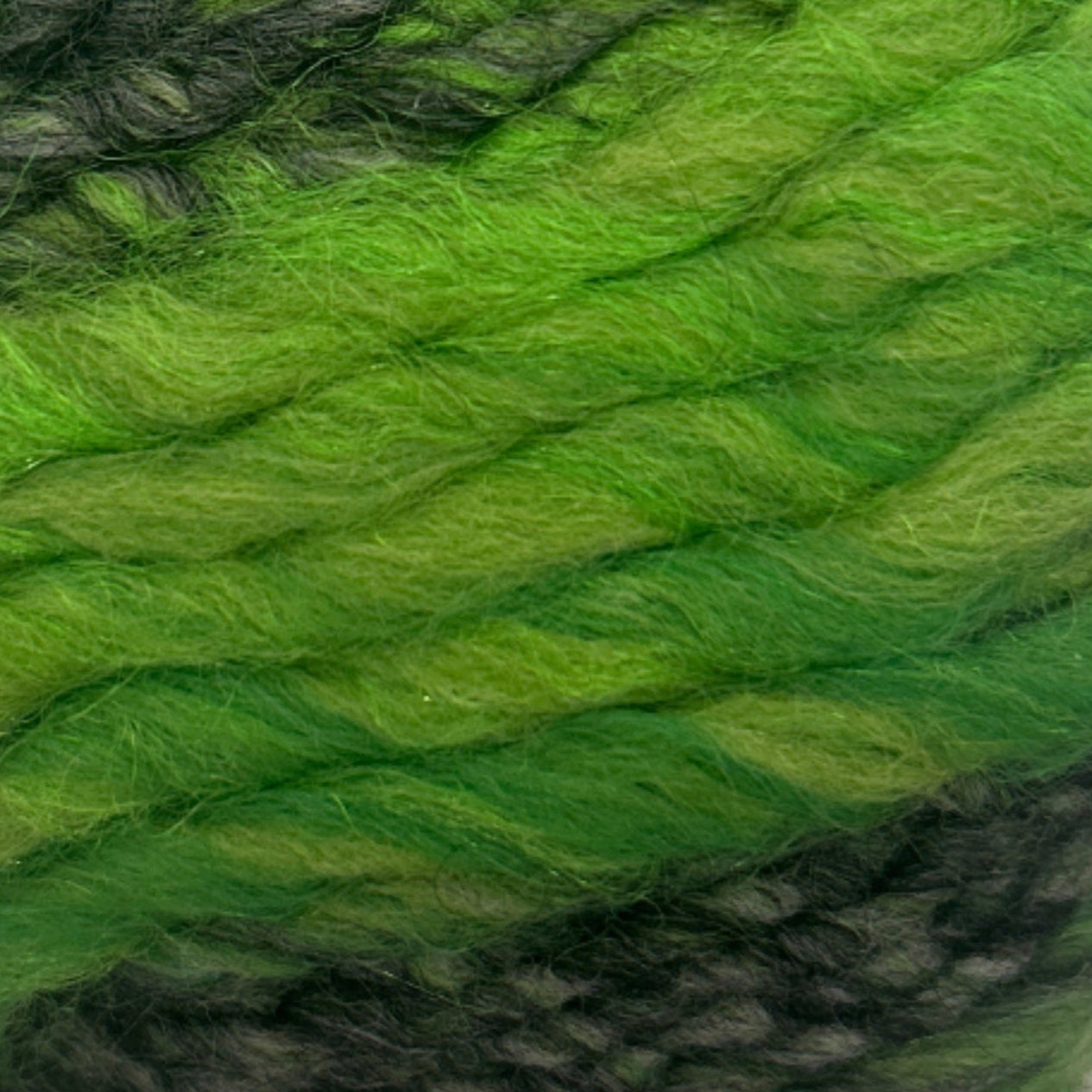 Green skein of yarn on a white background