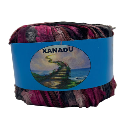 Multicolored yarn ball with a blue Xanadu label on a white background