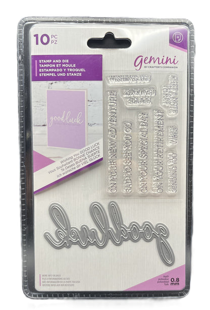 Packaging of Gemini stamp and die set with 'good luck' and 'heal' stamps on a white background.