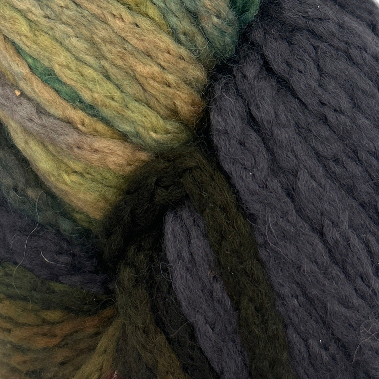 Close-up of green and gray yarn skeins