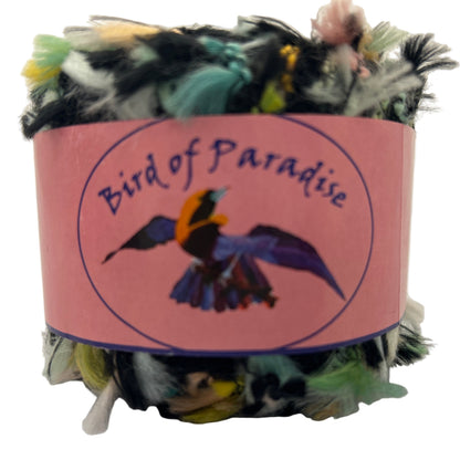 Bird of Paradise toy with colorful feathers and a pink label on a white background