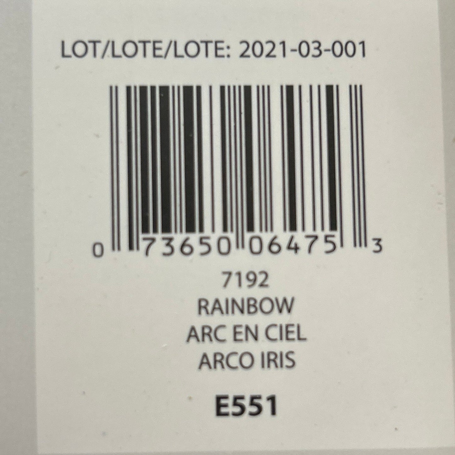 Product label with barcode and text on a wooden surface