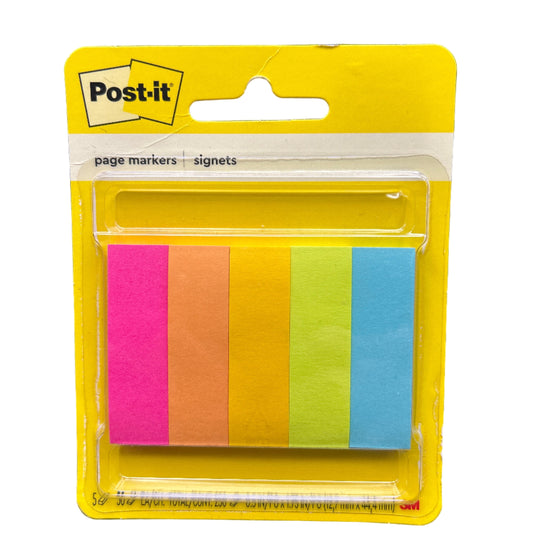 Packaged colorful Post-it notes on a black background