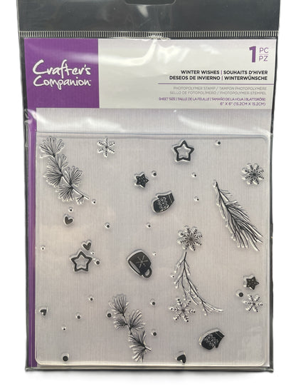 Packaged set of metal dies with winter-themed designs on a clear background.