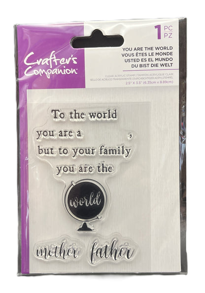 Packaged clear stamp set with text and globe design, brand 'Crafters Companion' visible.