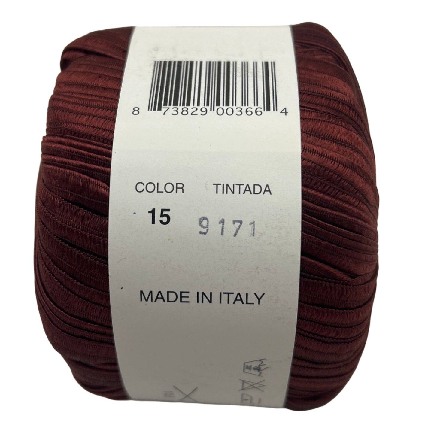 Brown yarn ball with a label on a light gray background