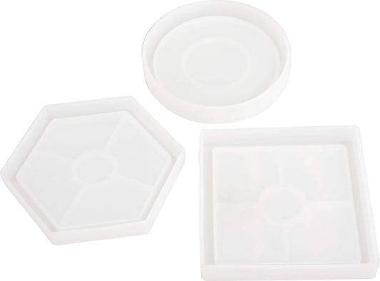Set of three white ceramic trays with different shapes on a white background