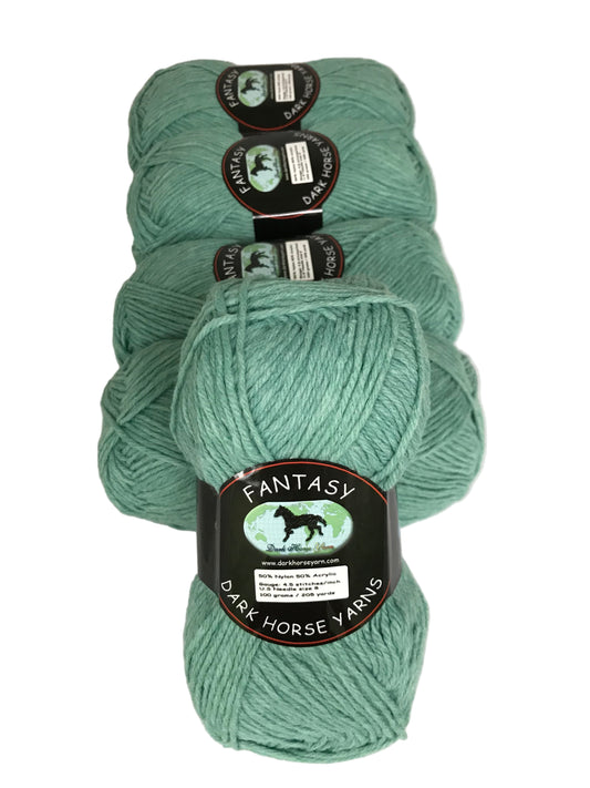 Three skeins of teal yarn with labels on a white background