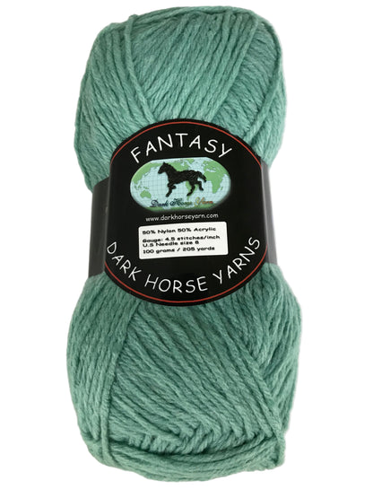 Green skein of yarn with a 'Fantasy' label from Dark Horse Yarns on a light gray background