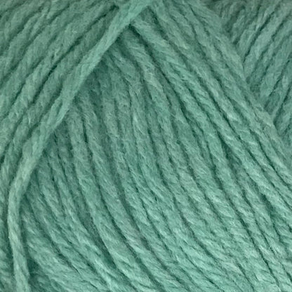Close-up of teal yarn with a textured pattern