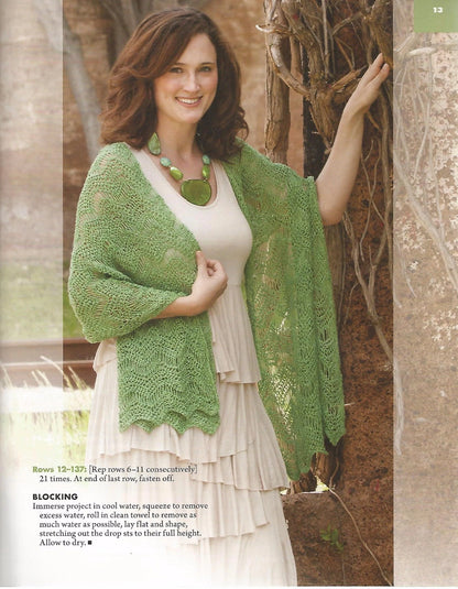 Woman wearing a green knitted shawl outdoors