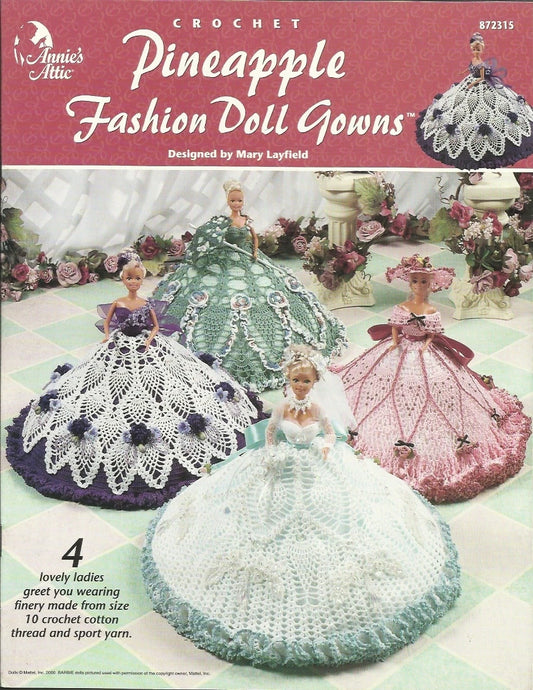 Crochet pattern book for Pineapple Fashion Doll Gowns by Annie's Attic with dolls and gowns on a pink background.