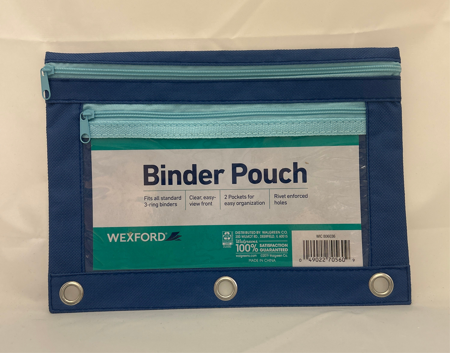 Blue and green binder pouch with Wexford branding on a beige background