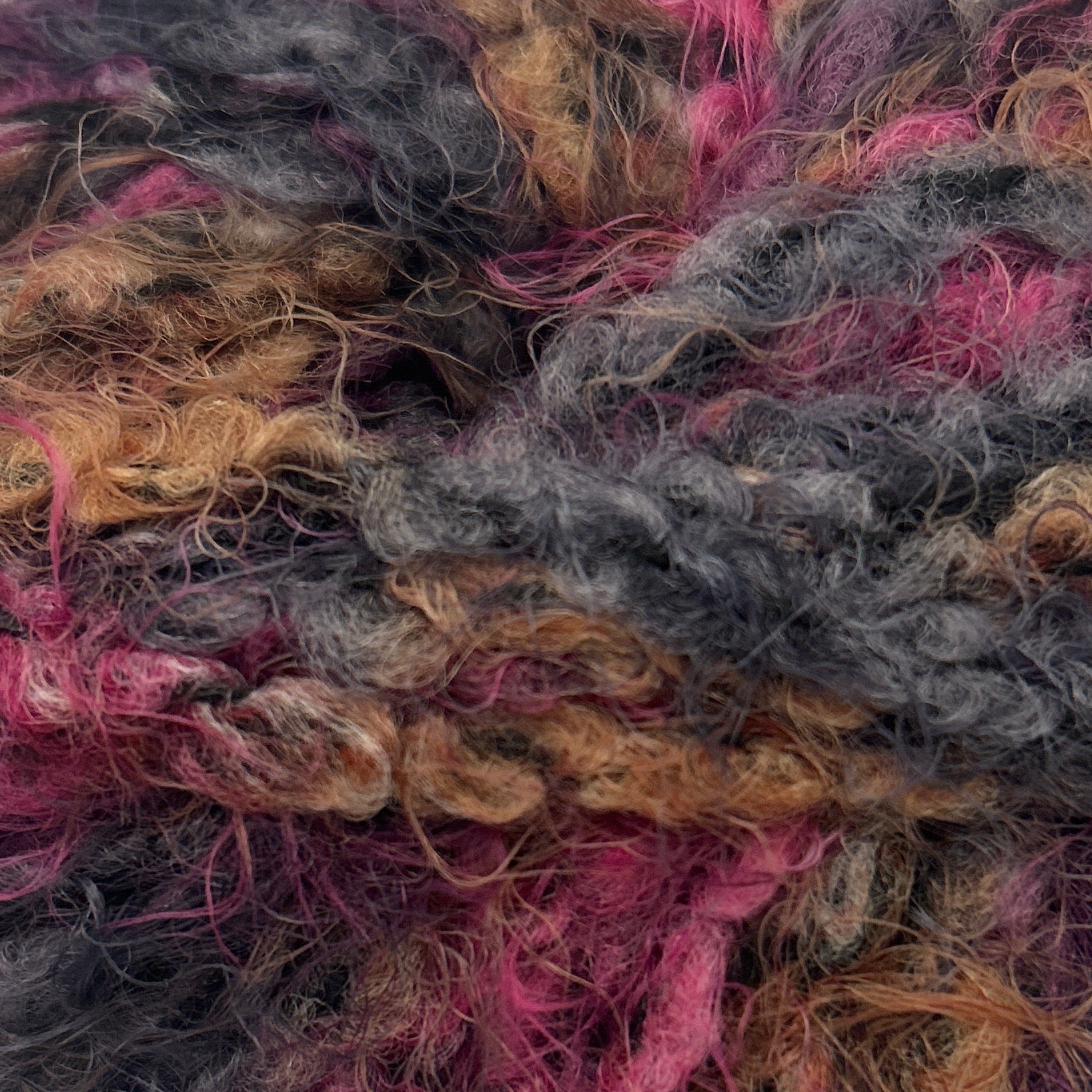 Multicolored skein of yarn on a white background