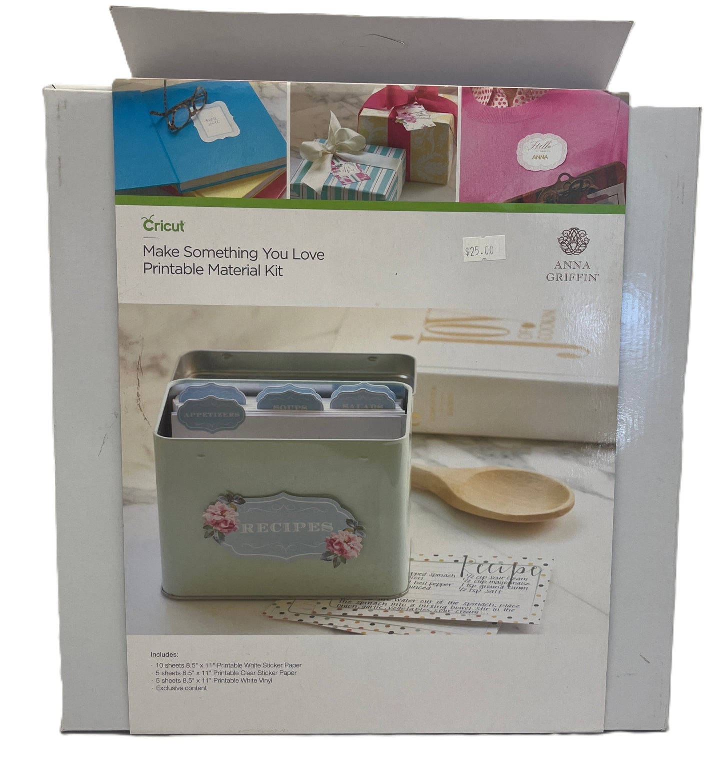 Cricut printable material kit packaging with images of printed materials and a tin.
