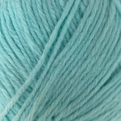 Turquoise skein of yarn with a label on a light gray background