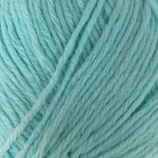 Turquoise skein of yarn with a label on a light gray background