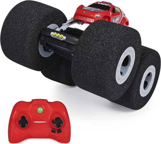 Red remote control car with black wheels on a white background