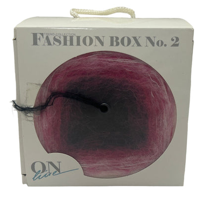 Fashion box with a purple ball and 'On Live' branding on a white background