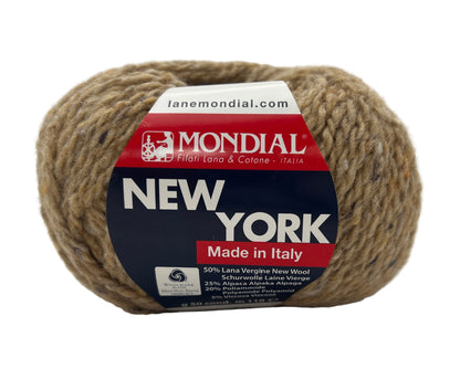 Ball of yarn with Mondial label on a white background