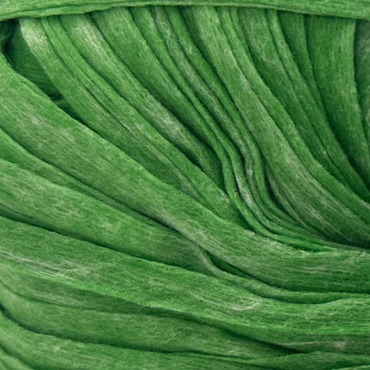 Green ball of yarn with a label on a white background