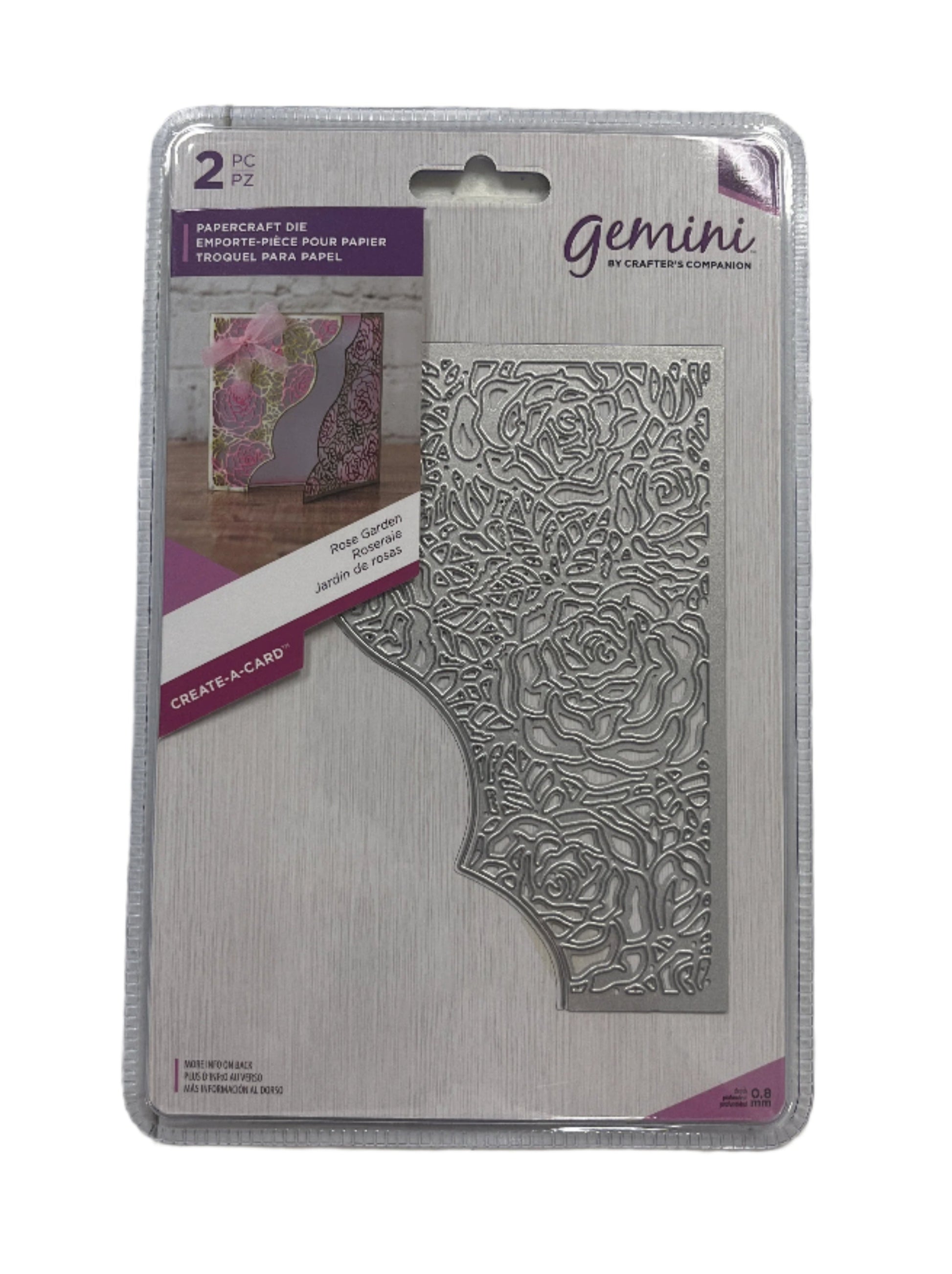 Packaged Gemini embossing folder with floral design on a white background