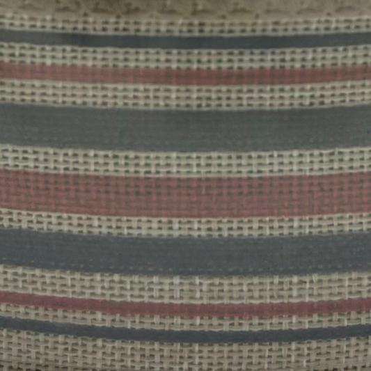 Close-up of striped fabric with red, blue, and beige colors.