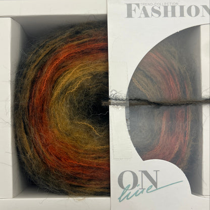 Multicolored yarn ball in a white packaging box with 'Fashion' branding.