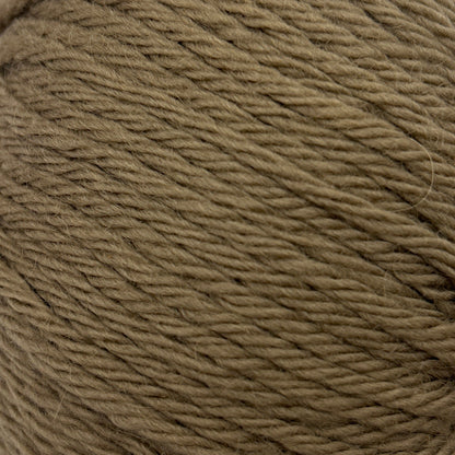 Ball of brown yarn on a white background