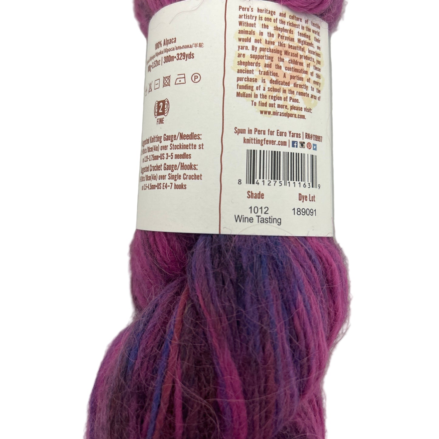Purple yarn skein with a label on a white background