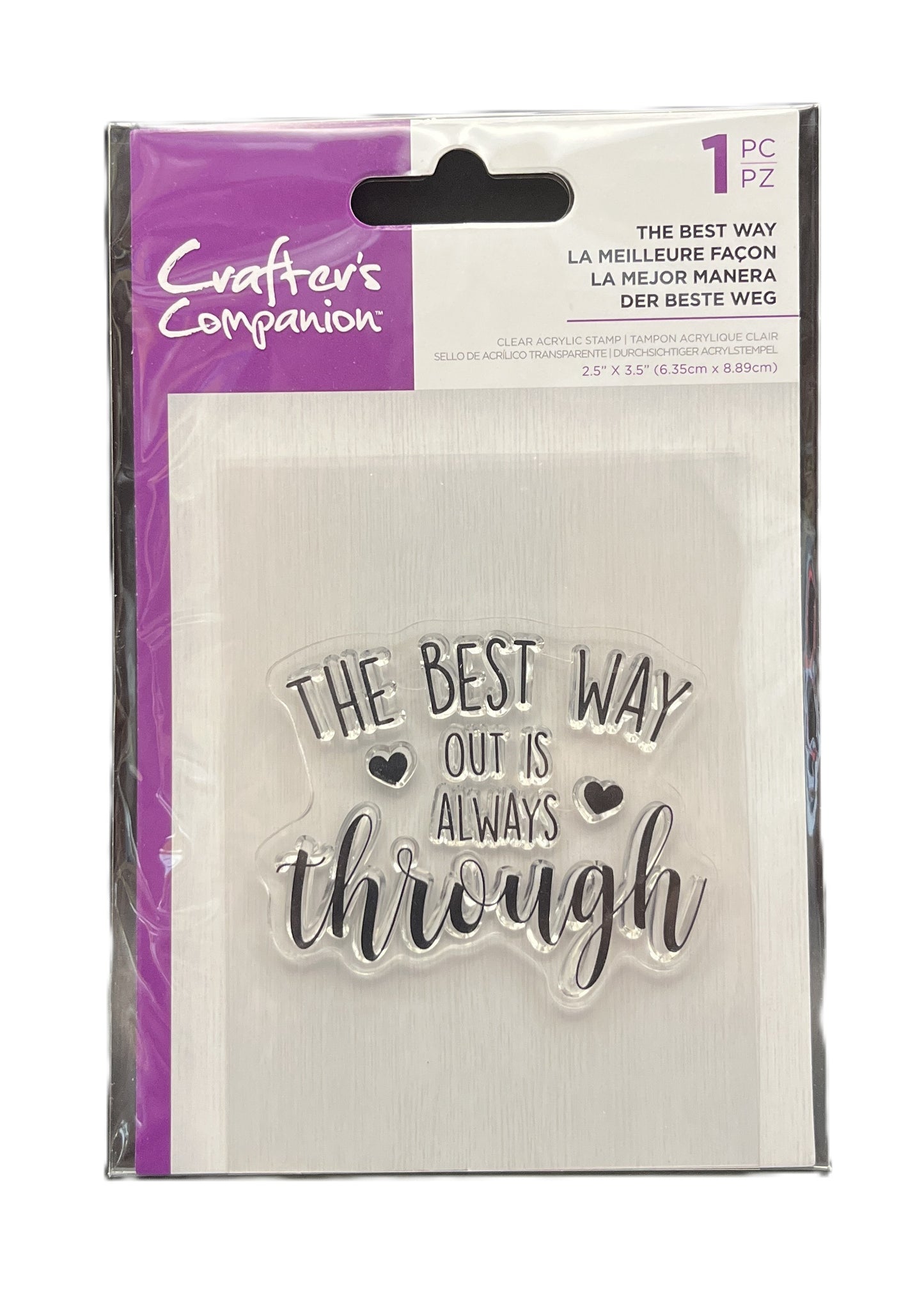 Packaged clear stamp set with 'The best way out is always through' text and heart symbols, brand 'Crafters Companion' visible.