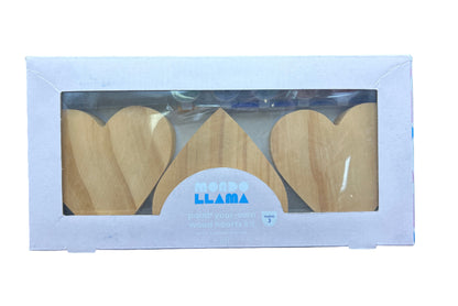 Wooden heart-shaped cutters in a white box with 'Llama' branding on a dark background