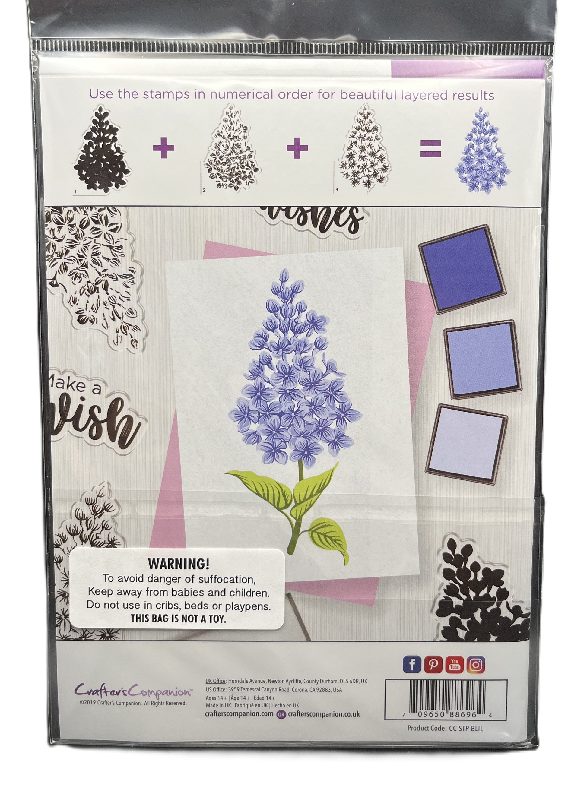 Packaging of a stamp set with floral design and warning label.