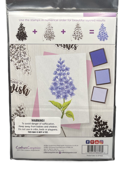 Packaging of a stamp set with floral design and warning label.