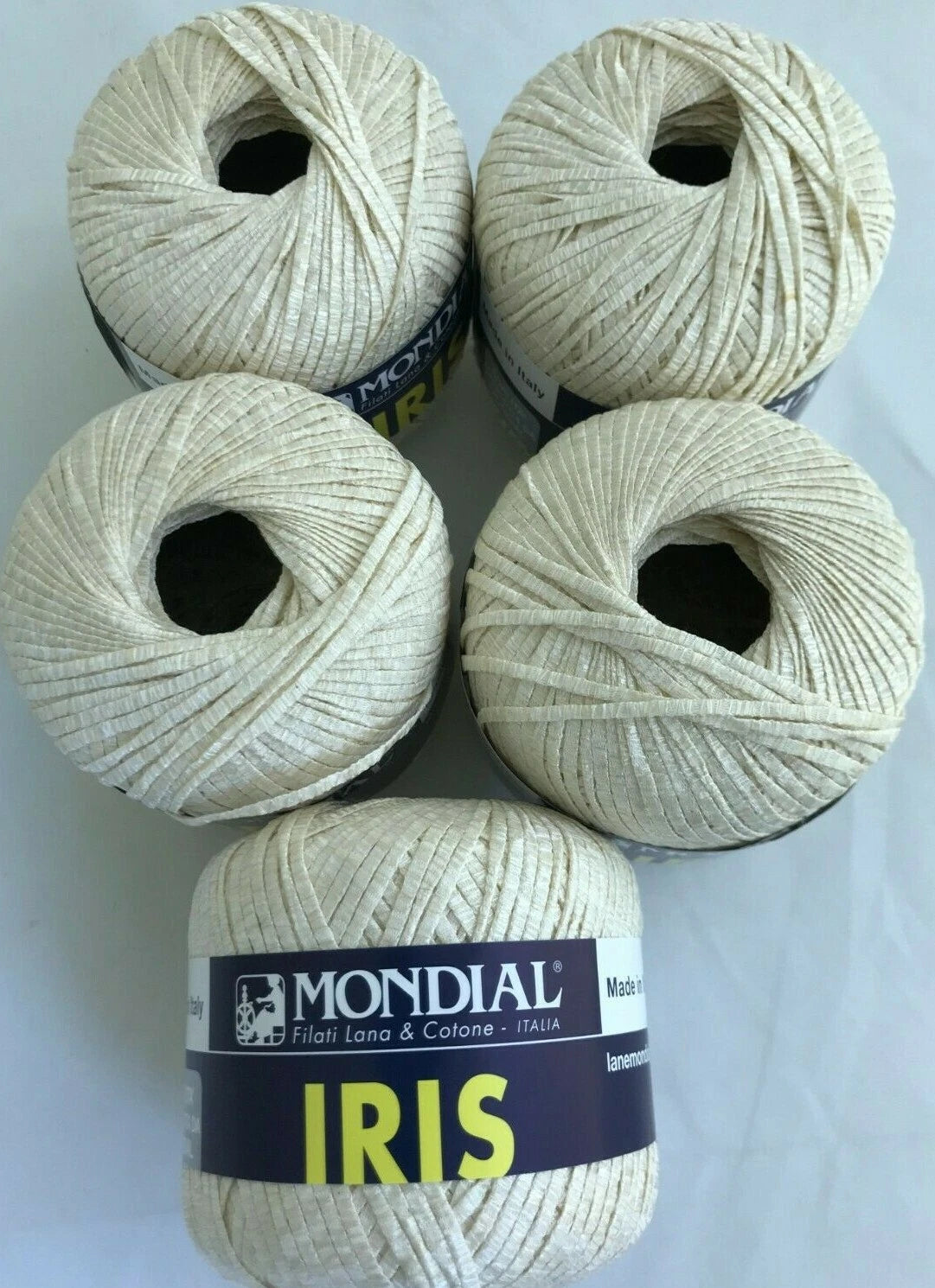 Five skeins of yarn with 'Mondial' labels on a white background