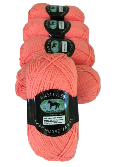Four skeins of pink yarn with labels on a white background