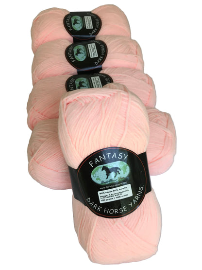 Pink yarn skeins with 'Fantasy' label on a white background