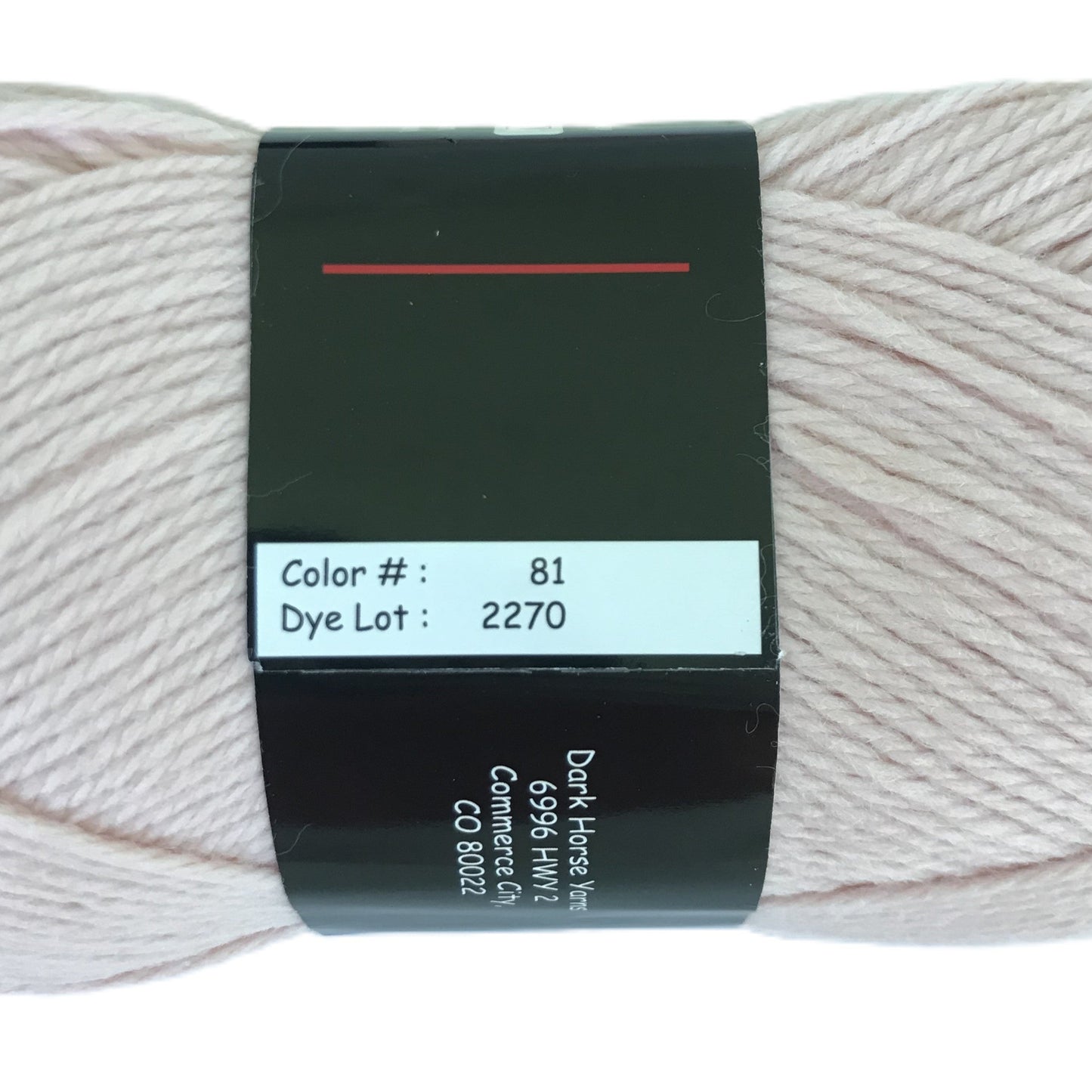 Ball of yarn with a label on a white background