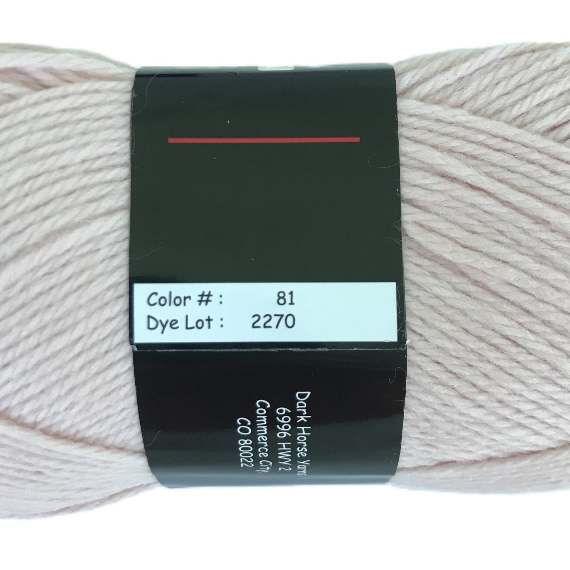 Ball of yarn with a label on a white background