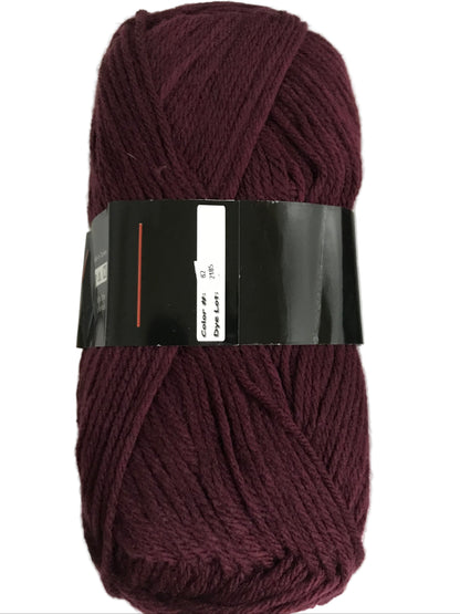 Burgundy skein of yarn with a label on a white background