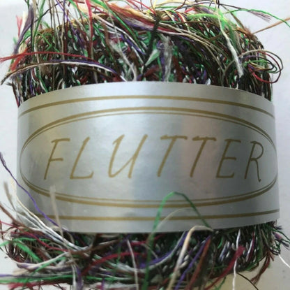 Multicolored fishing lure with 'FLUTTER' label on a white background