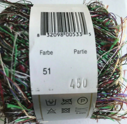 Multicolored yarn ball with a label showing a barcode and text.