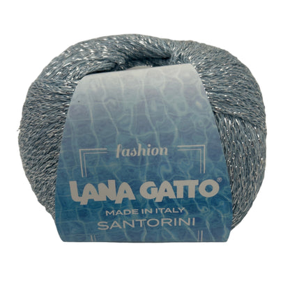 Ball of yarn with a label on a beige background