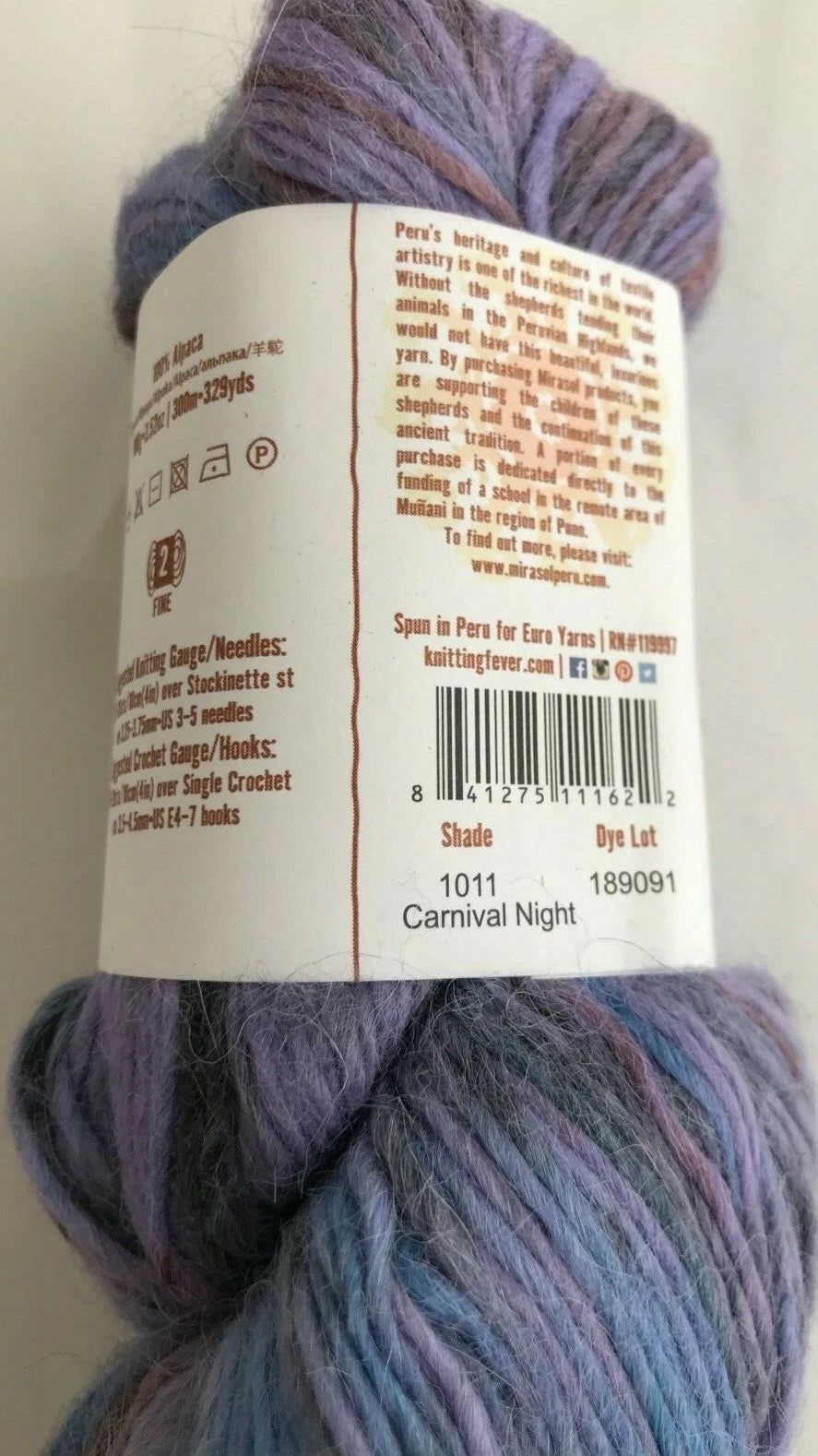 Multicolored yarn skein with a label on a white background