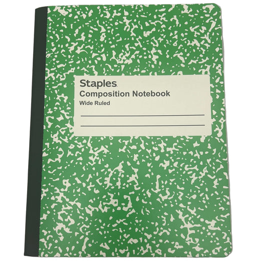 Green composition notebook with speckled pattern on a white background